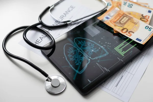 Health Insurance Online Application Form on screen tablet pc, health concept. Information technology and mobile application in healthcare. medical
