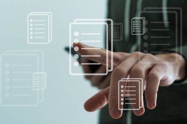 Businessman pressing virtual icons, virtual screen