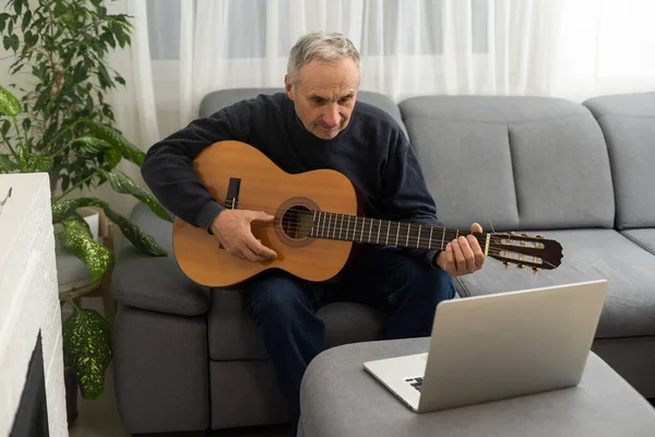 Portrait Senior Man Headphones Taking Online Guitar Lesson Looking Laptop — Stok fotoğraf