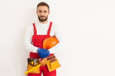 profession, construction and building - happy smiling male worker or builder over white background.