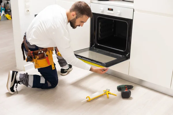 Repairman Examining Oven Screwdriver Kitchen Tool Case — Stock Fotó