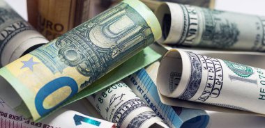 Close up of role money dollar tied with rope on white background