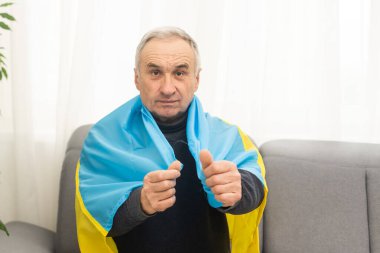 Mature man with flag of Ukraine.