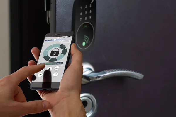 smart house, home automation, device with app icons. Man uses his smartphone with smarthome security app to unlock the door of his house