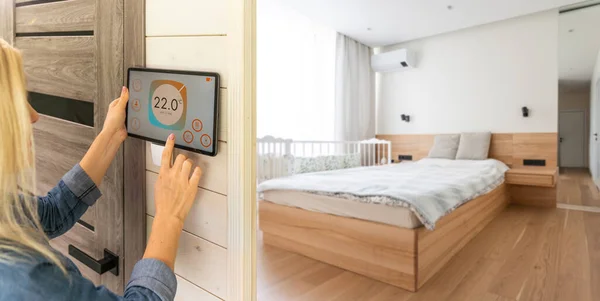 Woman pressing on smart home automation panel monitor.