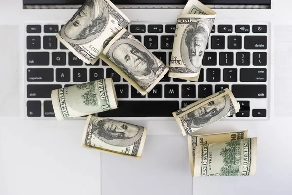 stock image Money on computer keyboard. roll.