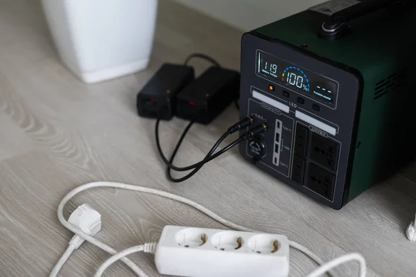 Charging station for phone, tablet, laptop and other gadgets when there is no light during blackout. Generator power bank battery in the absence of electricity. Charge electric rechargeable battery.