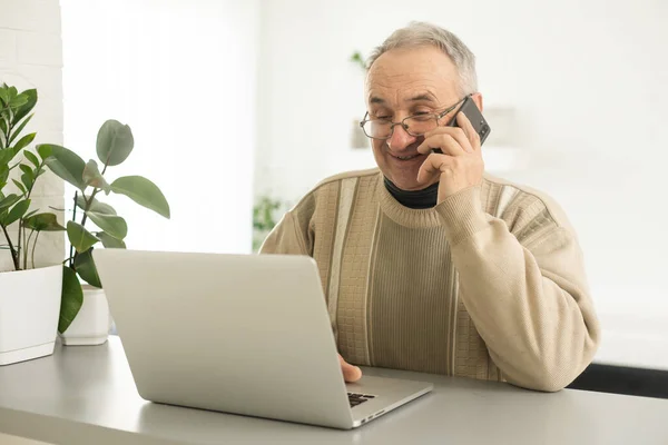 Senior Man Looking Laptop Phone Calling Home — Stok fotoğraf