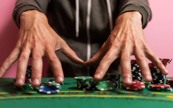 man playing blackjack at the table.