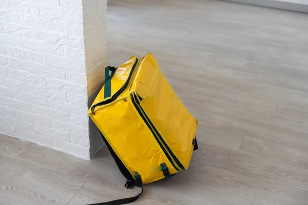 Yellow refrigerator bag for food delivery or for trip to nature and tourism. Thermo bag that keeps food from spoiling.