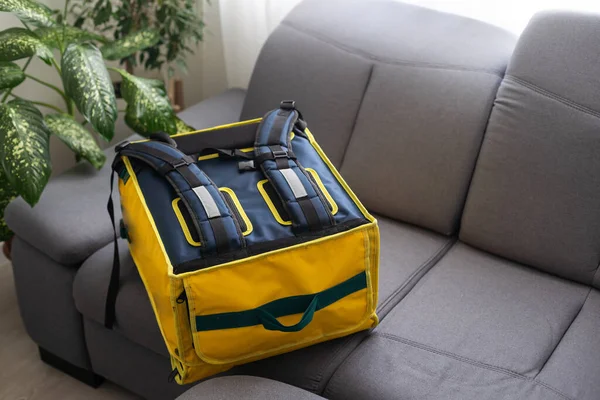 Yellow refrigerator bag for food delivery or for trip to nature and tourism. Thermo bag that keeps food from spoiling.