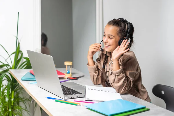 Learning Shocked Little Schoolgirl Looking Laptop Wearing Headphones Looking Computer — Stock fotografie
