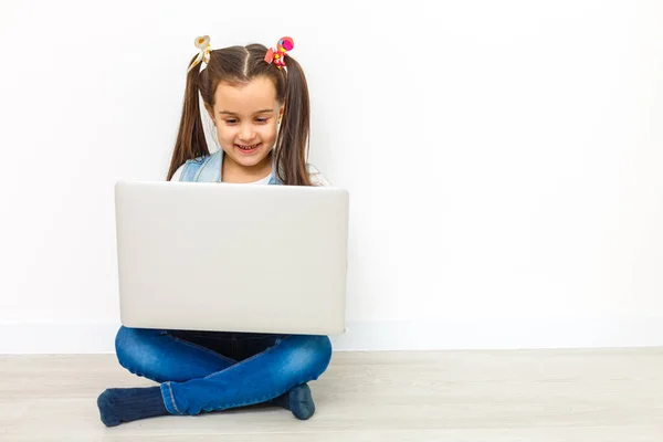 Cute Little Girl Sitting Floor Her Laptop Wearing Glasses Isolated — Stock Photo, Image