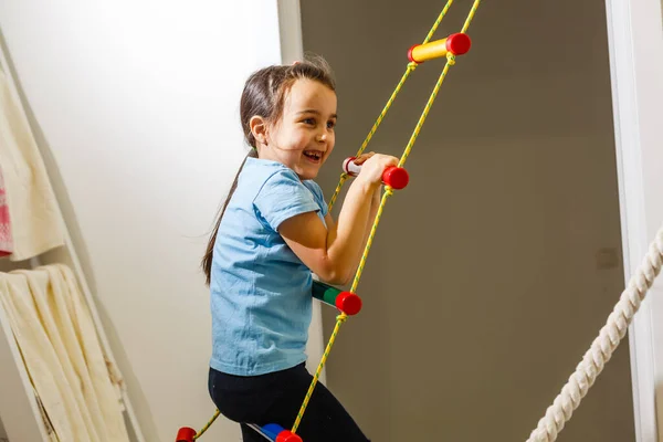 Beautiful Athletic Girl Plays Sports Wall Bars Childrens Room — Stock Photo, Image