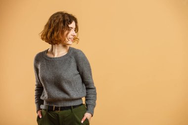 Closeup photo of amazing short hairdo lady looking up empty space deep thinking creative person isolated yellow color background.