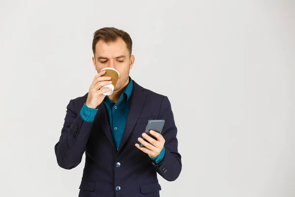 Confident Young Businessman Using Cell Phone Drinking Coffee — Fotografia de Stock
