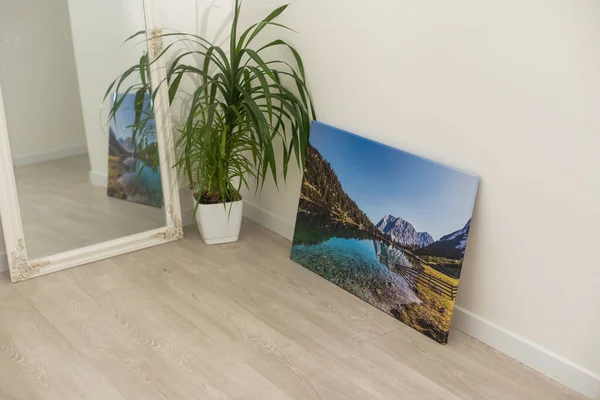 Print photography on canvas. Stretched photo canvas with gallery wrapping method, closeup, side view.