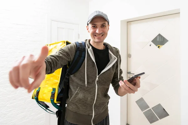 stock image High angle portrait of handsome delivery man with cardboard box