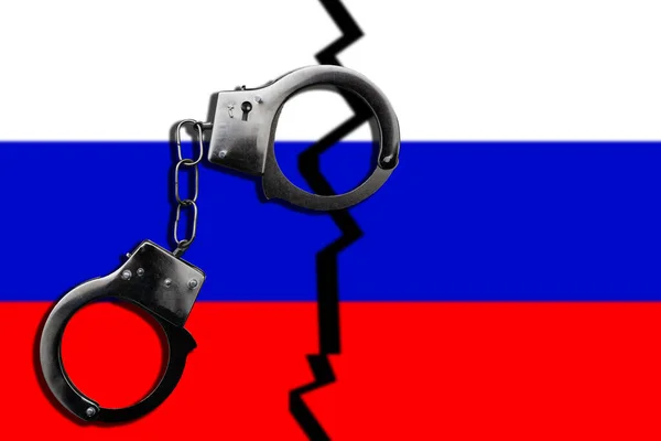 Concetto Legge Crimine Sono Manette Sulla Bandiera Della Russia Foto — Foto Stock