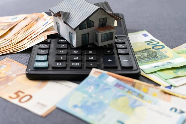 House model on banknotes. Investment property concept. High quality photo
