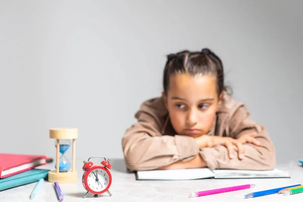 Pretty Little Girl Tired Doing Homework Table — Stockfoto