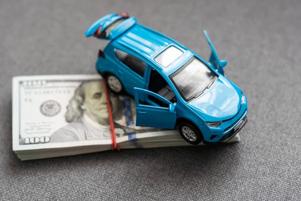 car and money. concept of car, Rent, car insurance, Toy car and money over white