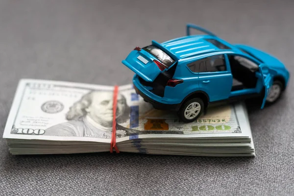 car and money. concept of car, Rent, car insurance, Toy car and money over white