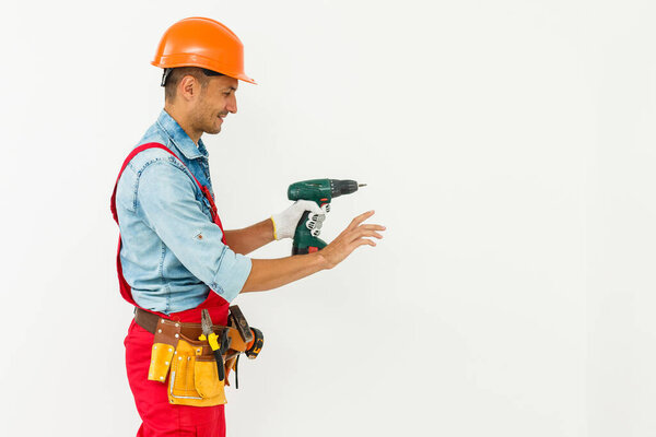 Construction worker with helmet and screwdriver.