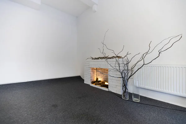 Decorative fake fireplace in room.