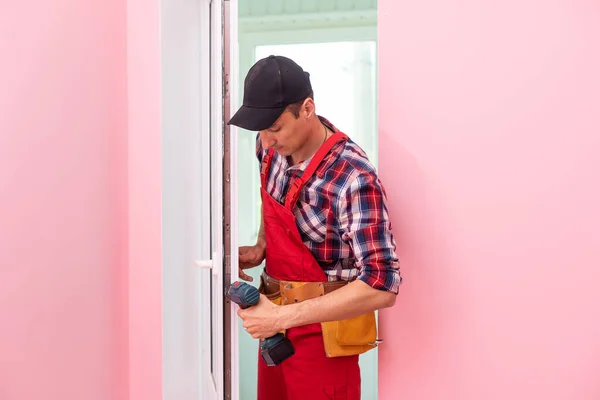 Handyman Adjusting White Pvc Plastic Window Indoors Worker Using Screwdriver — Stock Photo, Image