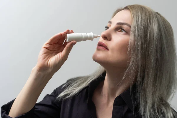 Woman Using Nasal Spray Light Background Closeup — Foto Stock