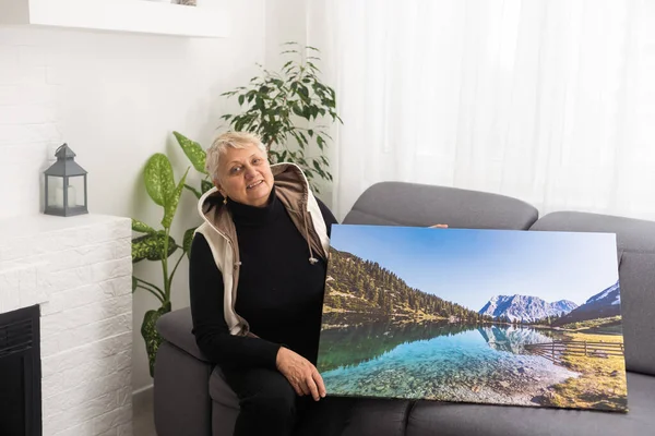 Canvas print with gallery wrap. old woman with photo canvas.