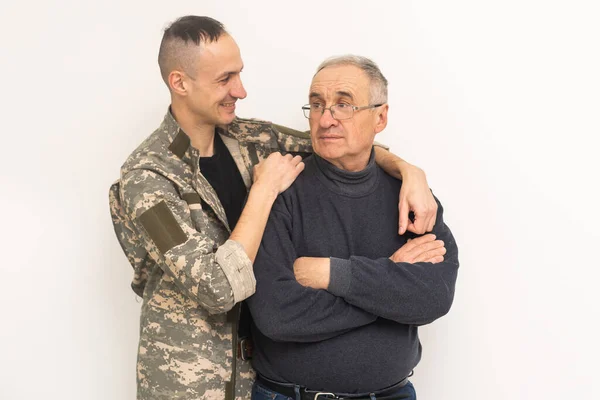 stock image an elderly father and a military son.