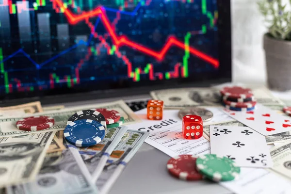 stock image Red casino chips on top of a financial newspaper