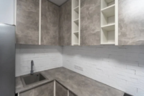 Blurred view of modern stylish kitchen interior. High quality photo