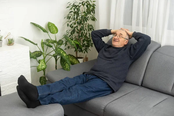 Smiling Calm Mature Man Relaxing Sitting Armchair Resting Feet Free — Stock Photo, Image