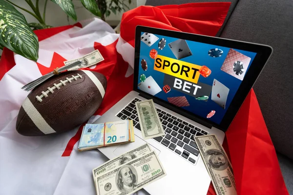 スポーツへの賭けとカナダの国旗が付いたノートパソコン — ストック写真