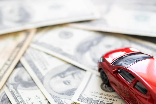 Toy car, money, documents. The concept of buying and insuring cars. Car, money.