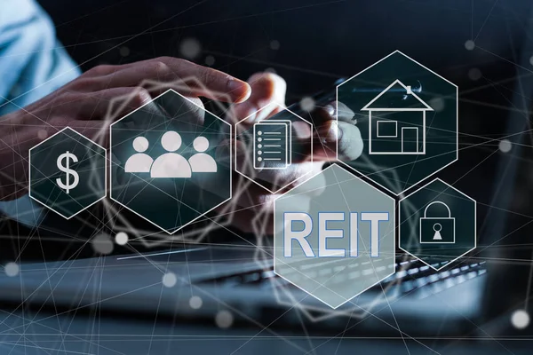 stock image REIT, Real Estate Investment Trust concept, Person hand using smart phone with Real Estate Investment Trust icon on virtual screen