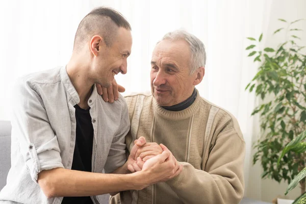 Young Adult Caucasian Son Listening Supporting His Old Elderly Senior — Stock Photo, Image
