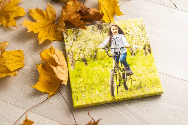 Blank square canvas frame on autumn background. Mockup poster with colourful autumn leaves.