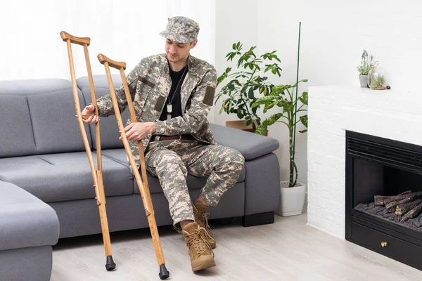 military Wounded Soldier Using Crutch.