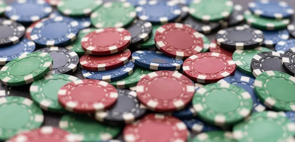 Plastic casino chips background. Poker game.