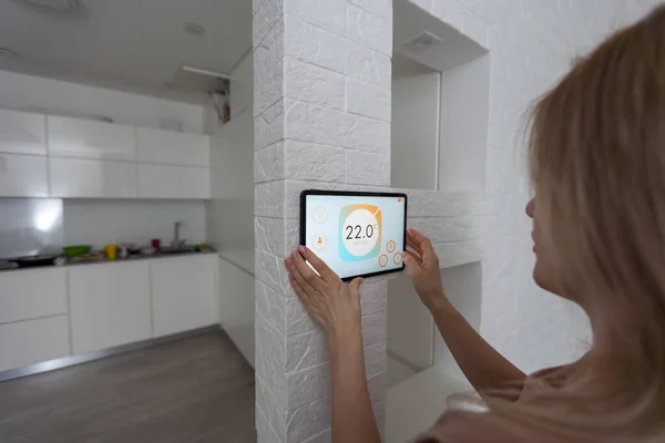 Woman Controlling Home Digital Touch Screen Panel Installed Wall Living — Stock Photo, Image