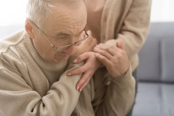 Stock image Nurse holding hand of senior man in rest home.