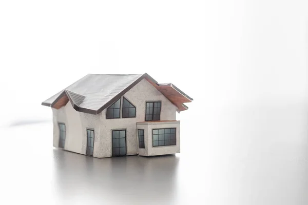 stock image Model of house painted white under the tiled roof.