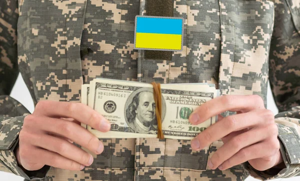 Ukrainian military man with money.