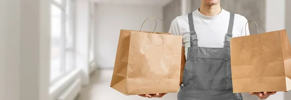 Young Handsome Delivery Man Holding Paper Bag Takeaway Food Happy — Stock Photo, Image