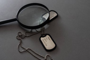 Military ID tags magnifying glass.