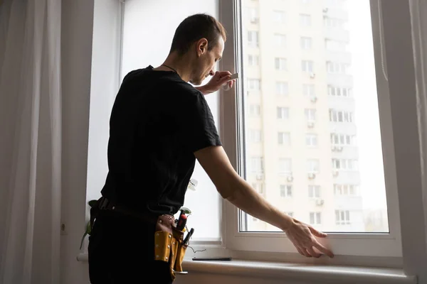 stock image Construction worker installing new window in house. High quality photo